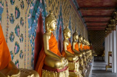 The view of Wat Arun ordination hall buddhist statues. Wat Arun or temple of the dawn is a famous temple in Bangkok, Thailand