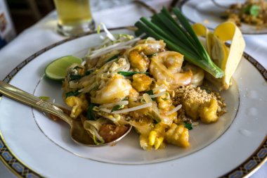 A fresh plate of Pad Thai with shrimp. Taken in a restaurant in Bangkok, Thailand