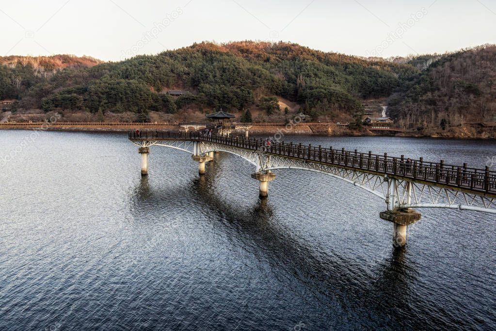 Woryeonggyo Bridge sunset view in Andong is a famous wooden footbridge over the nakdong river. Located in Andong, South Korea.