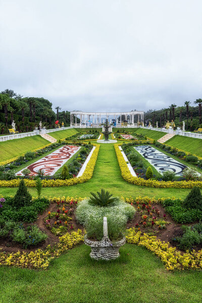 The main garden in Oedo botanical garden island taken during a rain storm. Tourist enjoying the view of the garden in rain. Oedo, Geoje, South Korea. Taken on July 12th 2020