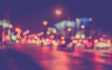 Görüntü için arka plan kullanım Caddesi'ndeki gece ışık bokeh bulanıklık. (vintage sesi)