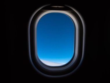 Mavi gökyüzü ile uçak pencere.