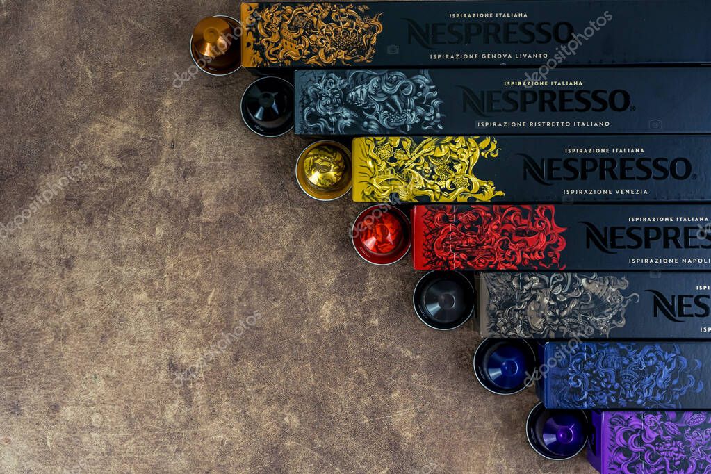 Bayonne, France. 23.06.2020. Nespresso cafe for decoration design. Dark brown background. Wooden background. Store label.