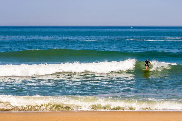 Surfing day in Biarritz, outdoor landscape. Beautiful waves background.