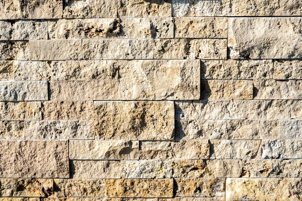 Stone wall brick texture background beige surface facade. Close - up. — Stock Photo, Image