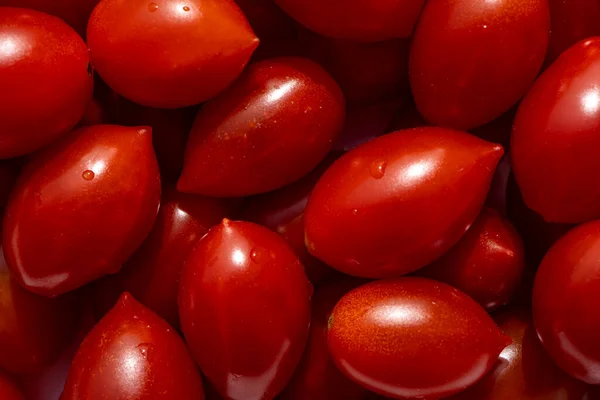 Texture of delicious red tomatoes in basket at the summer market place. Organic vegetables, It can be used as background. Selective focus