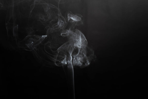 White smoke isolated on black background. smoke stock image.