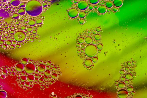 Abstract colorful bubbles. Mixing water and oil. Unrealistic colored bubbles, different color filters — Stock Photo, Image