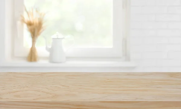 Defocused kitchen window sill background over wooden texture board