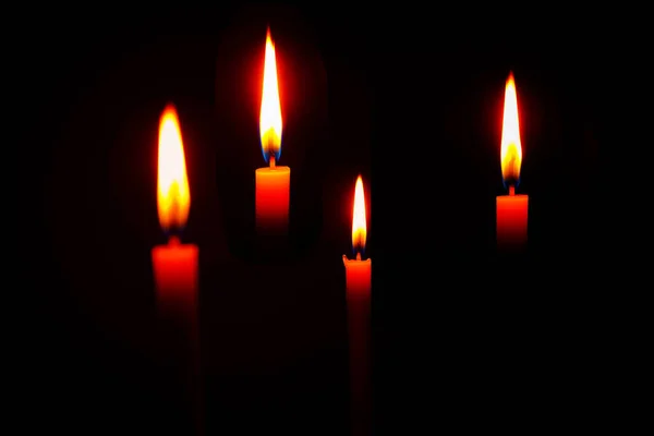 candle lit in a dark room with dark background, Candle flame at night. Lighting design for background.