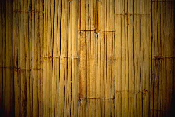 Bamboo wall, The wall is made of bamboo that hit the trunk of the bamboo and then put together the room wall, brown bamboo wall for making advertising background.