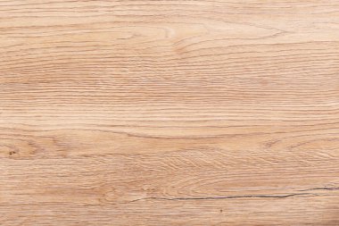 Açık kahverengi ve turuncu çam ağacı deseni. Yüzeysel kesik yüzeyi olan tahta arkaplanı.