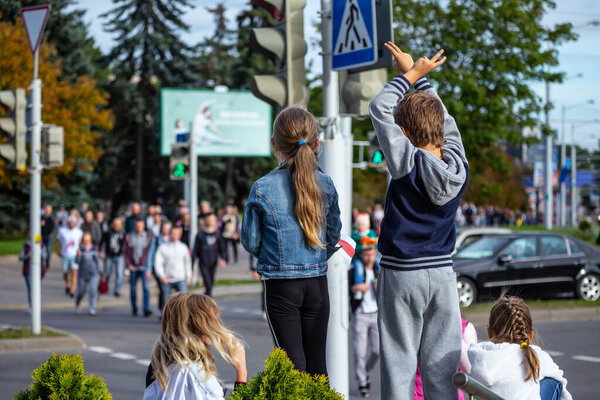 Minsk, Belarus, September 13, 2020. Peaceful protests after presidential elections. Kids cheer protesters.