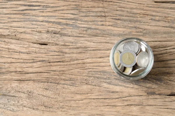 Ansicht Von Münzen Glasflasche Auf Holzgrund — Stockfoto