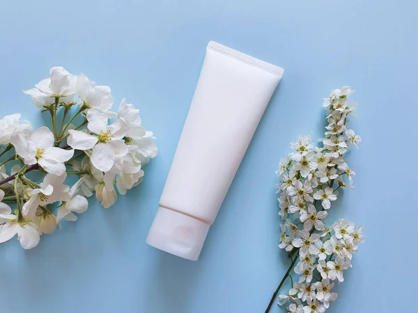 Mockup of white bottle plastic tube with facial moisturizer cream or facial cleanser. Space for your cosmetic and makeup products. Concept bio organic beauty products with natural extract and vitamin