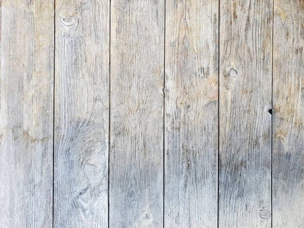 Vintage wooden texture with cracks. Light gray brown surface, closeup