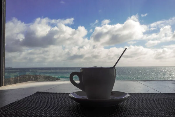 coffee on a table with sea views