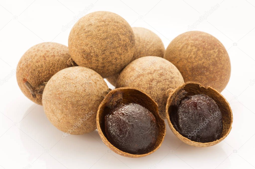  Dried Longan fruits on background,close up