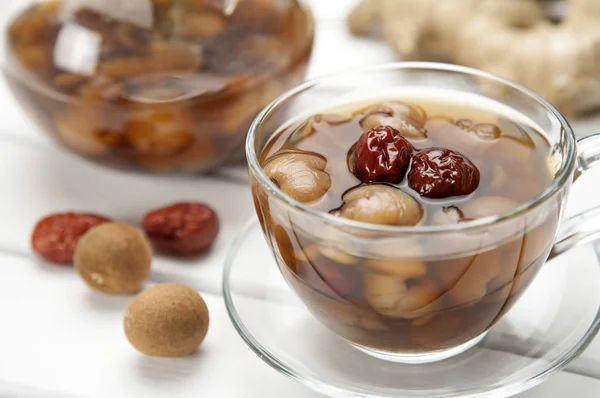 Longan ve arka plan üzerinde kırmızı tarihleri kapat