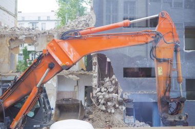 Construction Site and Excavator in city