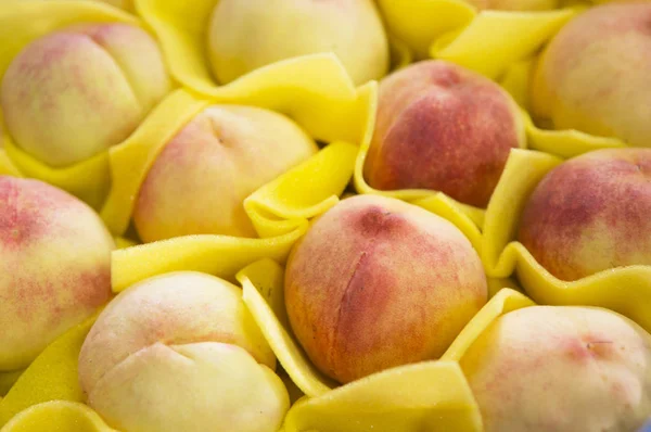 fresh,tasty peaches on background,close up