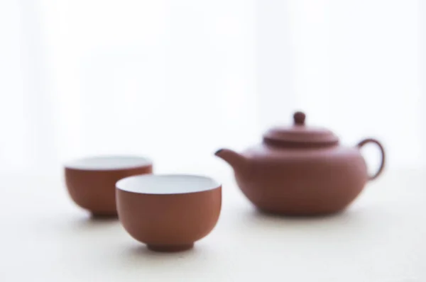 Tea Cups, Tea Kettle on background,close up