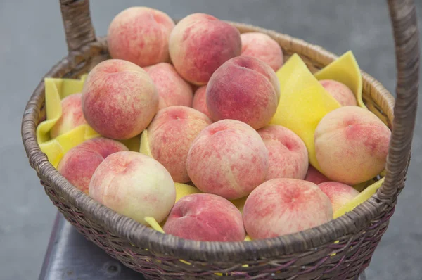 fresh,tasty peaches on background,close up