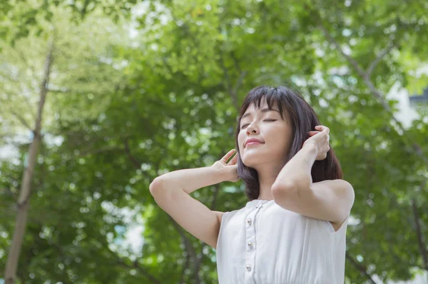 Young Woman White Dress Hands Her Eyes Closed Woods — Stock Photo, Image