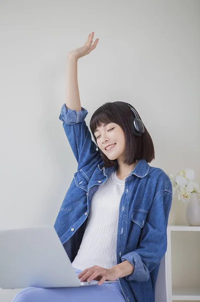 Young Woman Denim Jacket Hands Listening Music Smiling Her Eyes — Stock Photo, Image