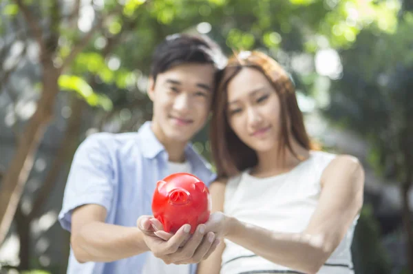 Young Father Pregnant Mother Holding Piggy Bank — Stock Photo, Image