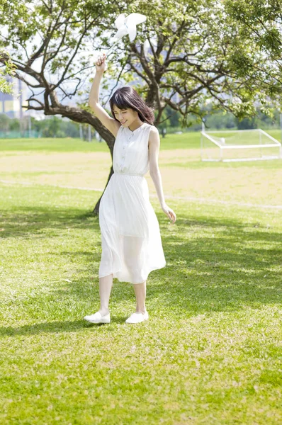 Young Asian Woman Holding Windmill Smiling — Stock Photo, Image