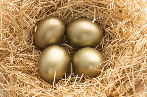 Gold eggs on background,close up