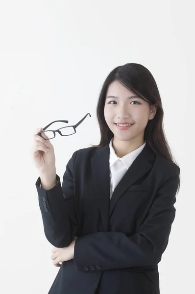 Young Asian Woman Wearing Suit Holding Glasses Smiling Camera — 스톡 사진