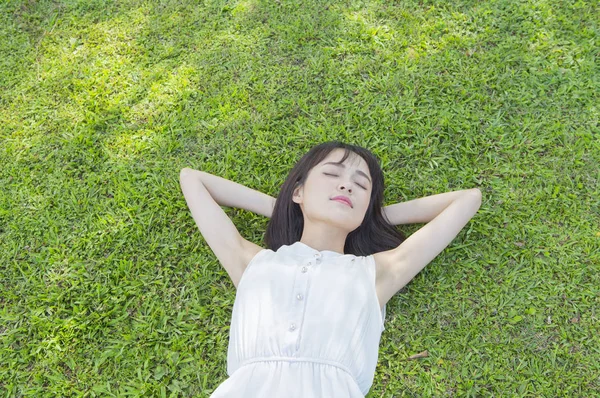 Young Asian Woman Wearing White Dress Lying Grass Taking Nap — Stock Photo, Image