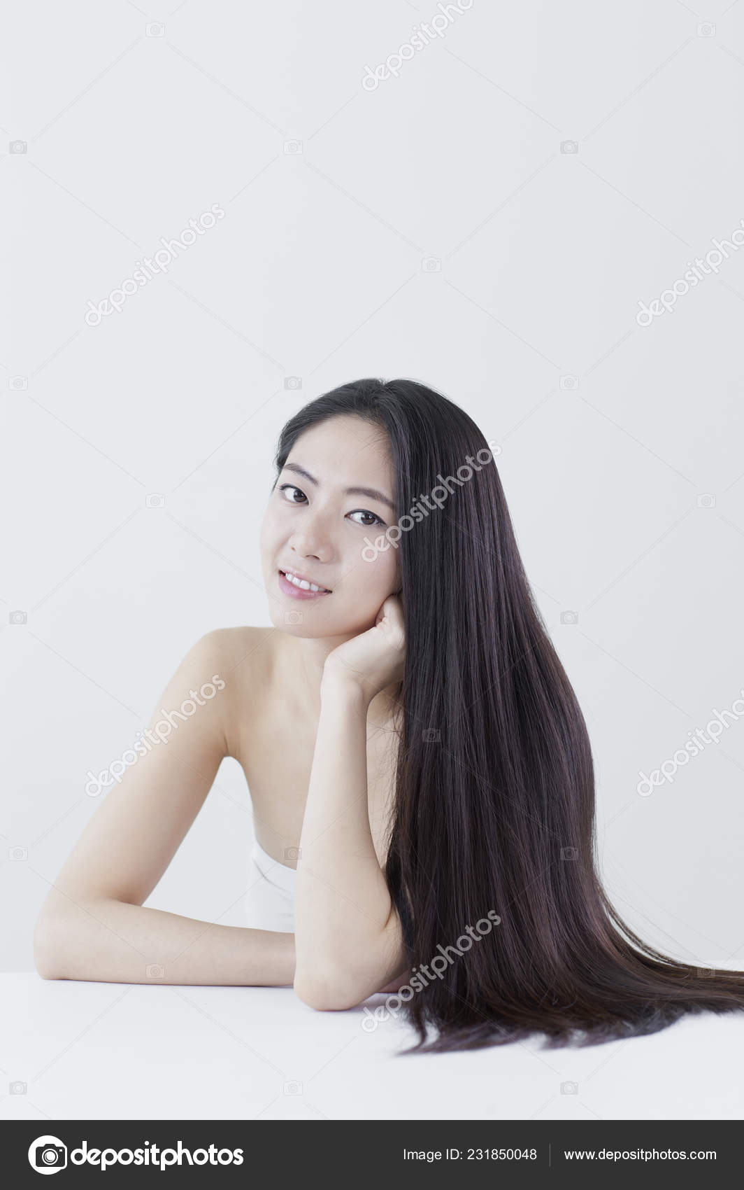Young Asian Woman Black Long Hair Hands Her Chin Looking Stock Photo C Imagemore 231850048