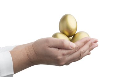 Altın Yumurta arka planda ellerde, yakın