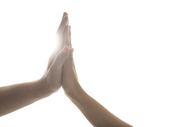 close-up view of people performing high five on white background 
