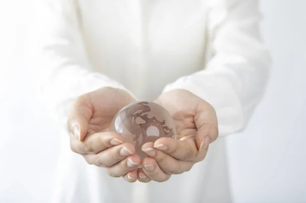 Female Hands Holding Glass Ball Isolated White Background — Stock fotografie
