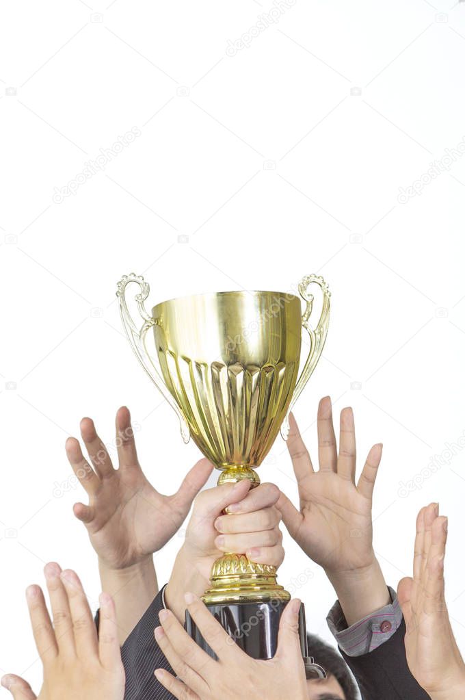 hands fighting for trophy cup isolated on white background
