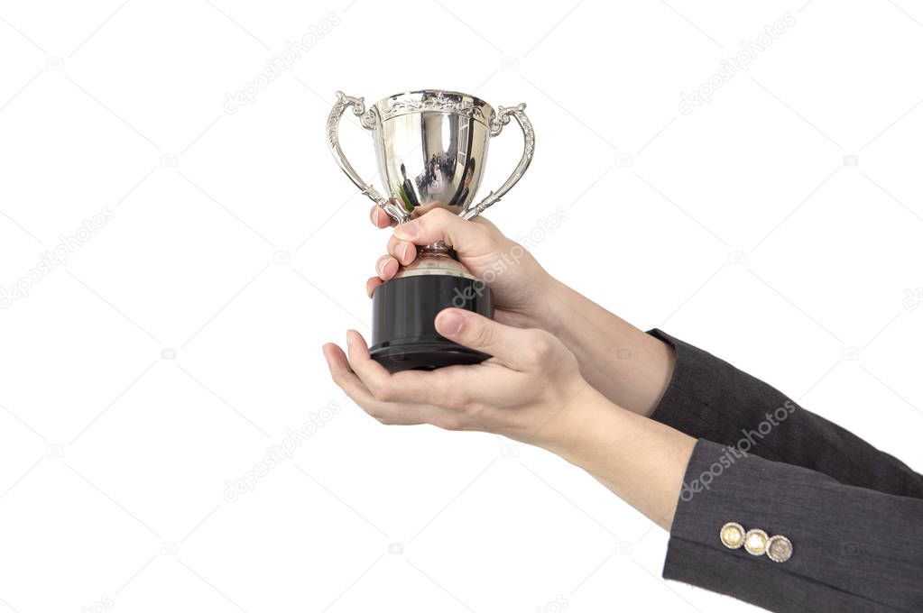 hands of businesswoman holding trophy cup isolated on white background