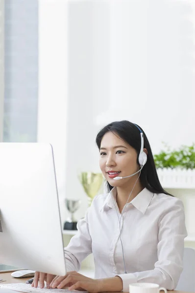 Asian business woman Call center operator at office