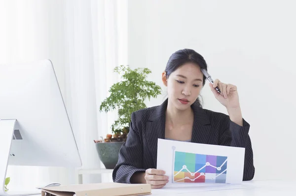 Asian business woman working in office