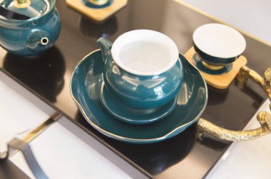 close up of oriental tea set on table