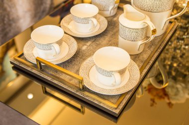close up on a table with kettle and cups