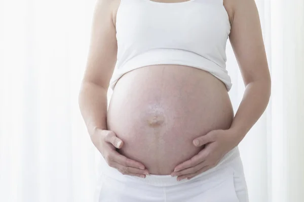 背景孕妇的肚皮 — 图库照片