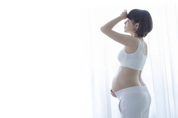 stock image young beautiful Asian pregnant woman