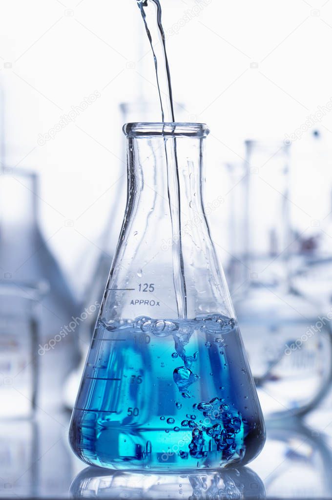 flask with blue liquid in lab