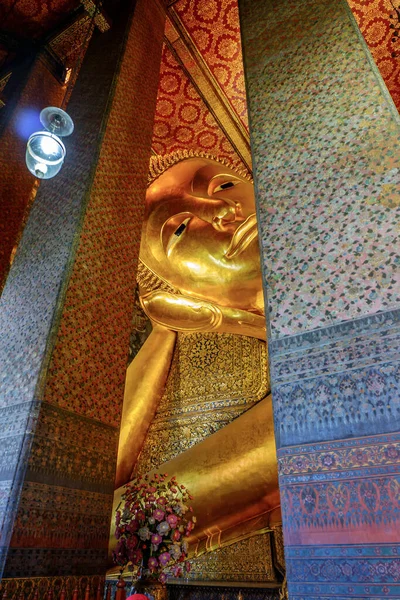 The Reclining Buddha at Wat Pho Temple, known as Temple of the Reclining Buddha (Bangkok, Thailand)