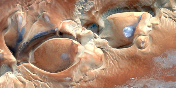 wind pottery, abstract photography of the deserts of Africa from the air, aerial view of desert landscapes, Genre: Abstract Naturalism, from the abstract to the figurative, contemporary photo 