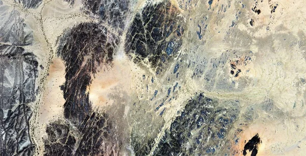 face to face, abstract photography of the deserts of Africa from the air, aerial view of desert landscapes, Genre: Abstract Naturalism, from the abstract to the figurative, contemporary photo